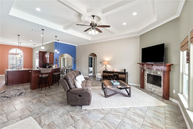 14106 Coquina Bay Ave, Corpus Christi, TX 78418 - living room with arched walkways, coffered ceiling, a high end fireplace, ceiling fan, and recessed lighting