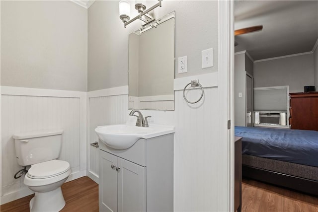 4446 Naples St, Corpus Christi, TX 78415 - bathroom featuring ensuite bathroom, cooling unit, a wainscoted wall, wood finished floors, and ornamental molding