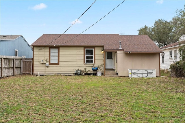 4446 Naples St, Corpus Christi, TX 78415 - rear view of house with entry steps, fence, and a yard