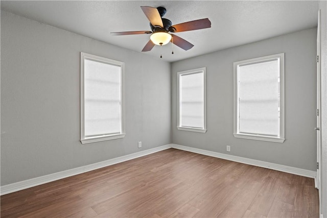 4446 Naples St, Corpus Christi, TX 78415 - empty room with ceiling fan, baseboards, and wood finished floors