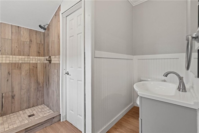 4446 Naples St, Corpus Christi, TX 78415 - full bathroom featuring a stall shower, a wainscoted wall, vanity, and wood finished floors