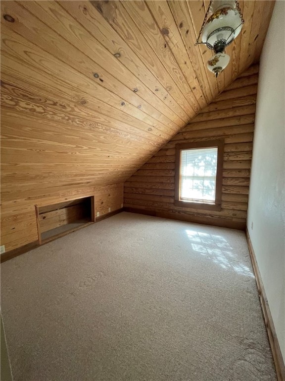 additional living space with carpet flooring, wooden ceiling, and vaulted ceiling