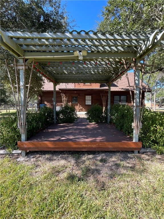 view of yard with a pergola and a wooden deck