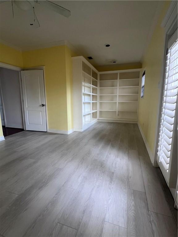 4502 Thoreau Cir, Corpus Christi, TX 78410 - empty room featuring wood finished floors and built in features