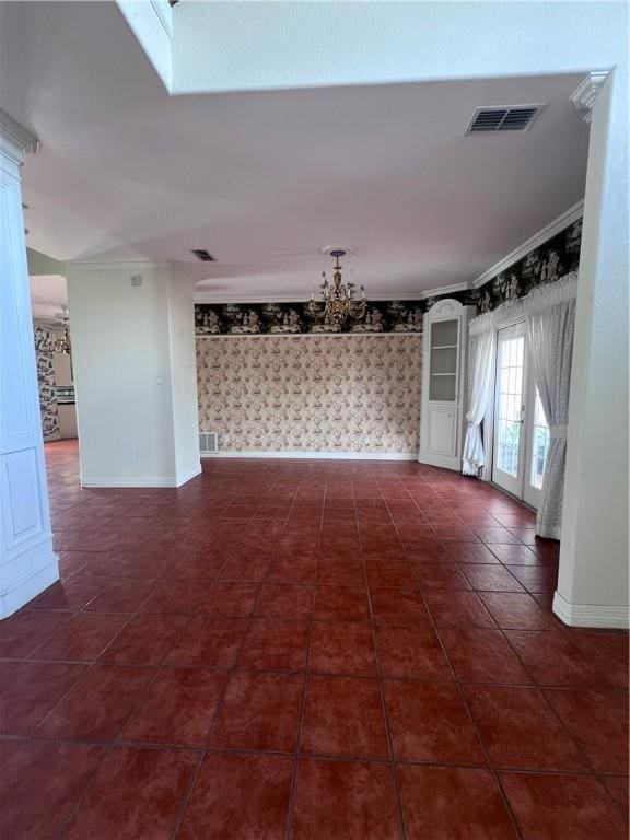 4502 Thoreau Cir, Corpus Christi, TX 78410 - empty room with wallpapered walls, a chandelier, crown molding, and dark tile patterned floors