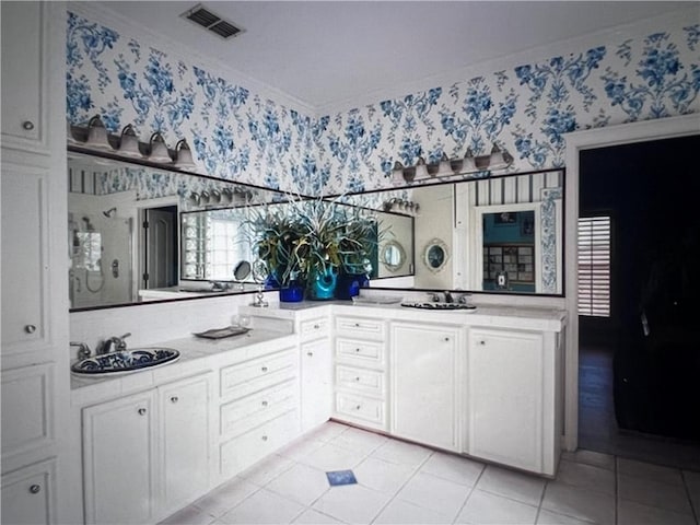 4502 Thoreau Cir, Corpus Christi, TX 78410 - full bath with wallpapered walls, double vanity, ornamental molding, and tile patterned flooring