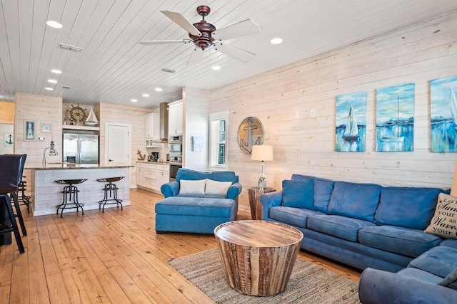 4903 State Highway 361 Unit 8, Port Aransas, TX 78373 - living room featuring recessed lighting, wooden walls, ceiling fan, light wood finished floors, and wooden ceiling