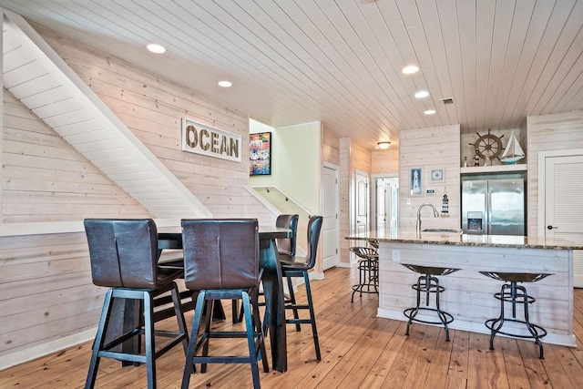 4903 State Highway 361 Unit 8, Port Aransas, TX 78373 - dining room featuring wooden walls, wooden ceiling, recessed lighting, and light wood finished floors