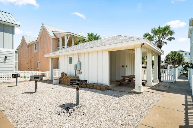 4903 State Highway 361 Unit 8, Port Aransas, TX 78373 - view of side of home with board and batten siding and roof with shingles