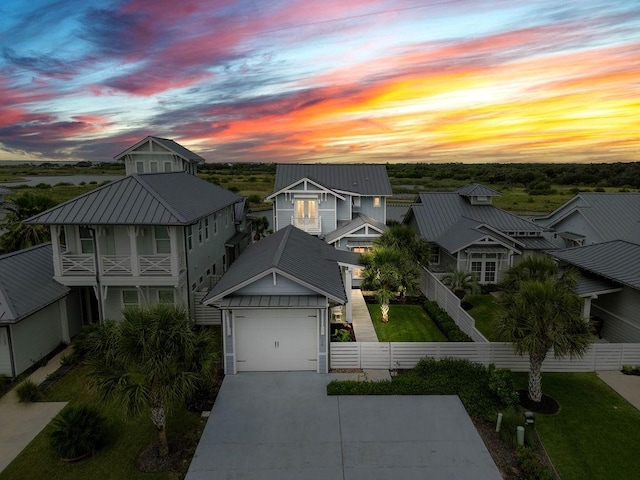 125 Reserve Ln, Rockport, TX 78382 - view of front facade featuring driveway, a metal roof, a garage, and a residential view