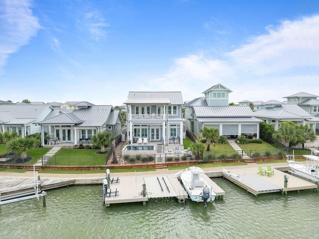 125 Reserve Ln, Rockport, TX 78382 - back of property featuring a water view, a fenced backyard, and stairway
