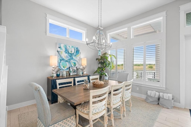 125 Reserve Ln, Rockport, TX 78382 - dining area featuring a chandelier, plenty of natural light, and wood finished floors