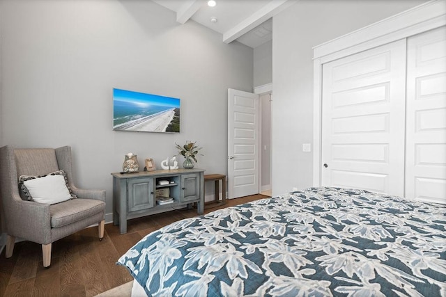 125 Reserve Ln, Rockport, TX 78382 - bedroom with beam ceiling, dark wood-style floors, a high ceiling, and a closet