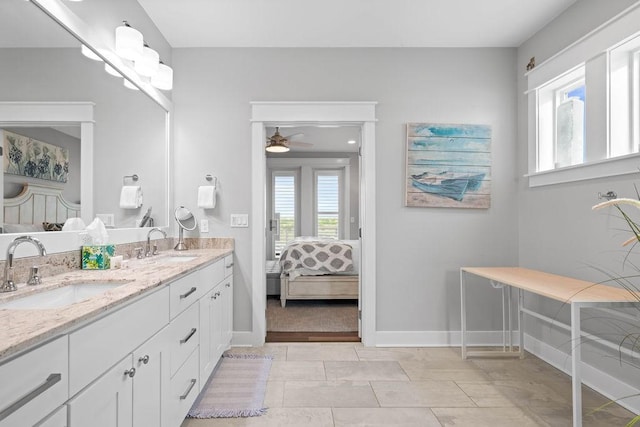 125 Reserve Ln, Rockport, TX 78382 - ensuite bathroom with double vanity and ceiling fan