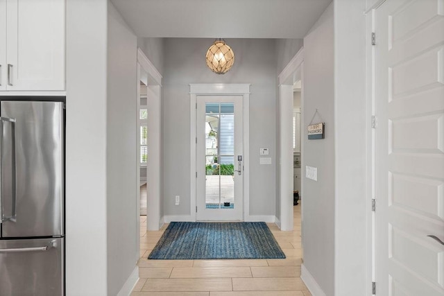 125 Reserve Ln, Rockport, TX 78382 - foyer entrance with baseboards and wood tiled floors