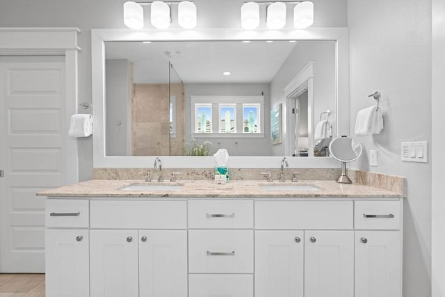 125 Reserve Ln, Rockport, TX 78382 - full bathroom with double vanity and a tile shower