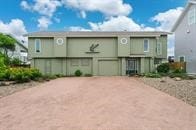 view of building exterior featuring dirt driveway