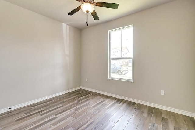 9509 Sedalia, Corpus Christi, TX 78410 - empty room featuring wood finished floors, baseboards, and ceiling fan
