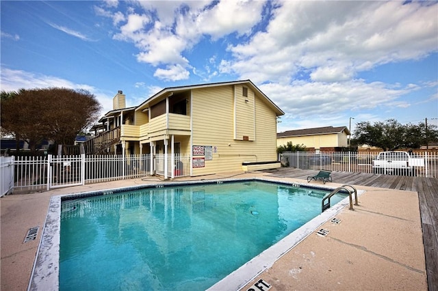 view of swimming pool featuring a patio area