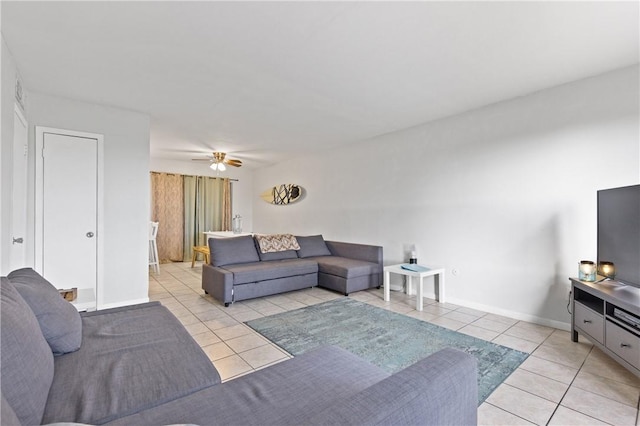 living room featuring ceiling fan and light tile patterned floors