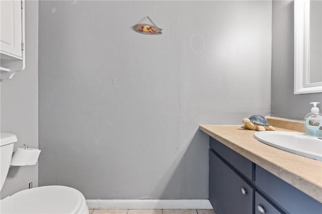 bathroom featuring tile patterned floors, vanity, and toilet