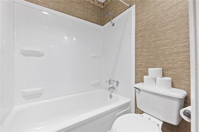 bathroom featuring toilet and tub / shower combination