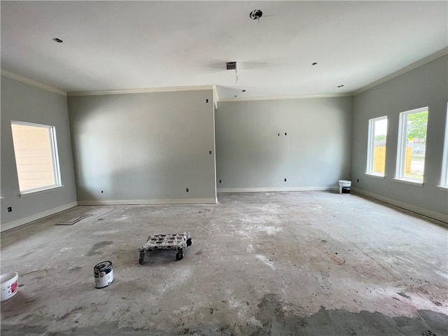 unfurnished room with baseboards and ornamental molding