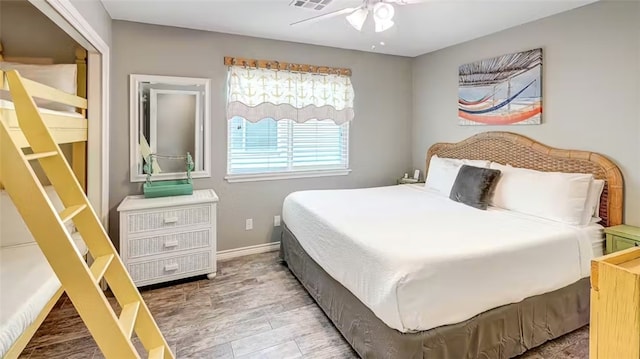 bedroom with hardwood / wood-style flooring and ceiling fan