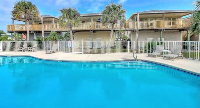 view of swimming pool featuring a patio area