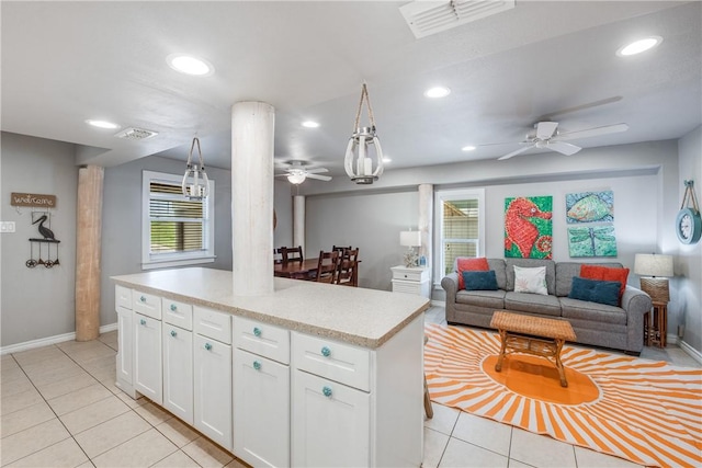 kitchen featuring light tile patterned floors, recessed lighting, visible vents, white cabinets, and light countertops