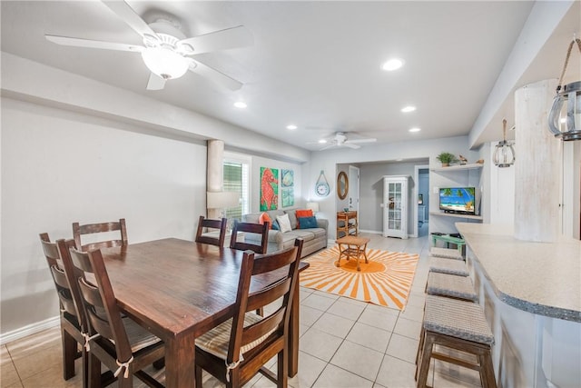 dining area with light tile patterned floors, ceiling fan, baseboards, and recessed lighting