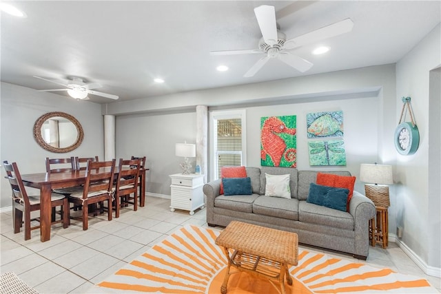 living area featuring light tile patterned floors, a ceiling fan, and recessed lighting