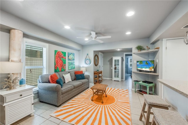 living room featuring light tile patterned floors, recessed lighting, visible vents, baseboards, and a ceiling fan