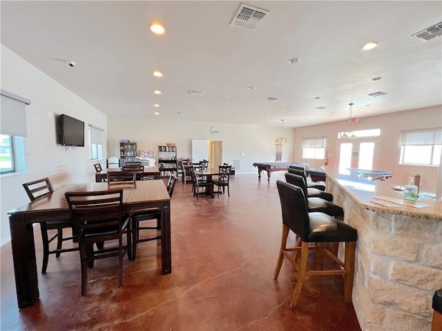 11 Augusta Cir, Aransas Pass, TX 78336 - dining room with finished concrete flooring, recessed lighting, and healthy amount of natural light