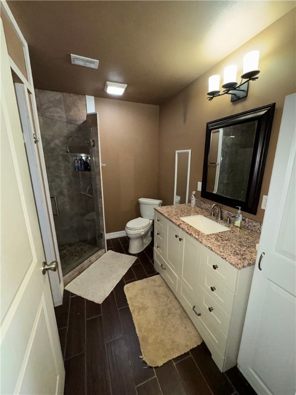 11 Augusta Cir, Aransas Pass, TX 78336 - full bathroom with vanity, a stall shower, and wood finish floors