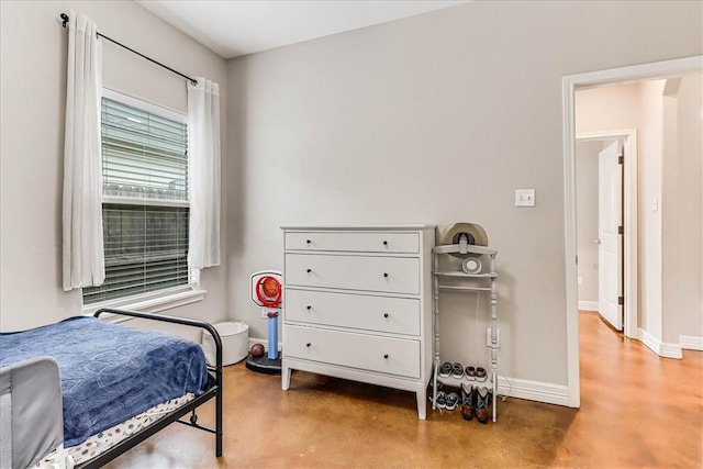 7237 Lake Tranquility Dr, Corpus Christi, TX 78414 - bedroom featuring baseboards and finished concrete flooring