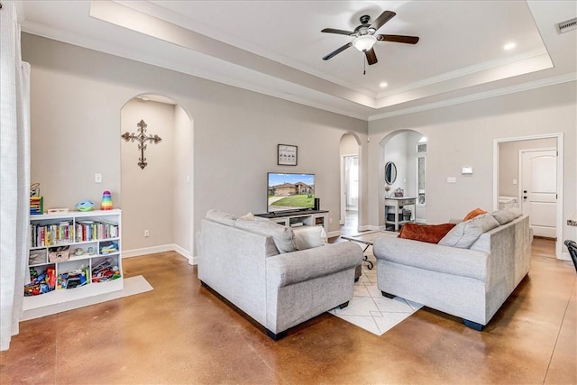7237 Lake Tranquility Dr, Corpus Christi, TX 78414 - living area featuring a tray ceiling, arched walkways, visible vents, finished concrete floors, and ceiling fan
