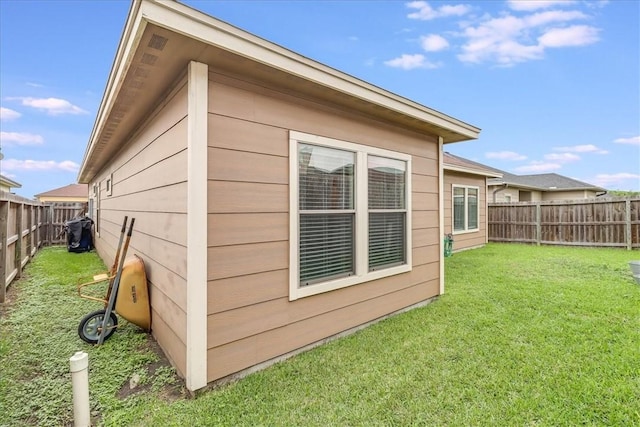 7237 Lake Tranquility Dr, Corpus Christi, TX 78414 - view of property exterior with a lawn and a fenced backyard
