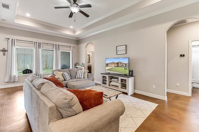 7237 Lake Tranquility Dr, Corpus Christi, TX 78414 - living area featuring visible vents, a ceiling fan, arched walkways, baseboards, and finished concrete floors