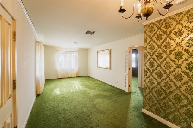 unfurnished room featuring crown molding and a healthy amount of sunlight