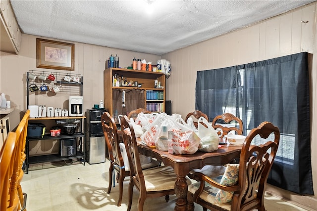 dining room with a textured ceiling