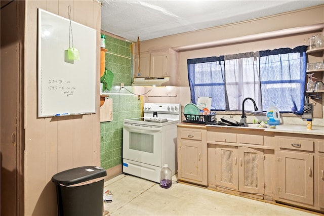 kitchen featuring range hood, tile walls, sink, and white electric range oven