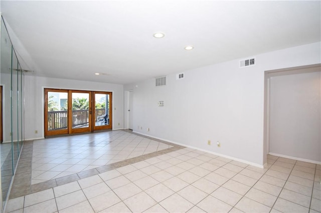 unfurnished room with light tile patterned floors