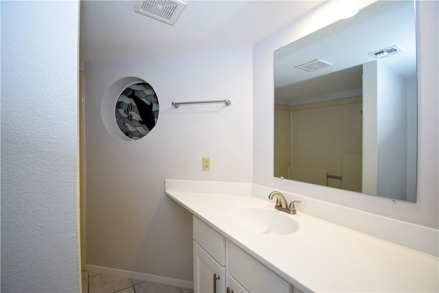 bathroom with vanity and tile patterned floors