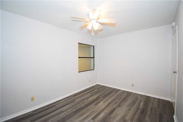 unfurnished room with dark hardwood / wood-style floors and ceiling fan