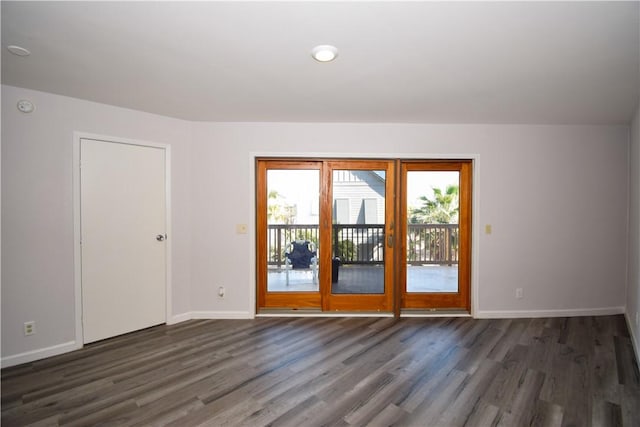 empty room featuring dark wood-type flooring