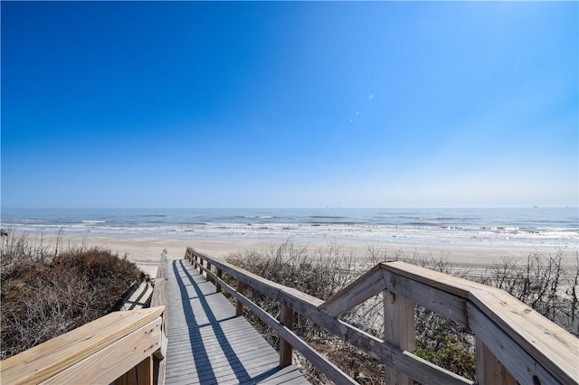 view of property's community with a view of the beach and a water view