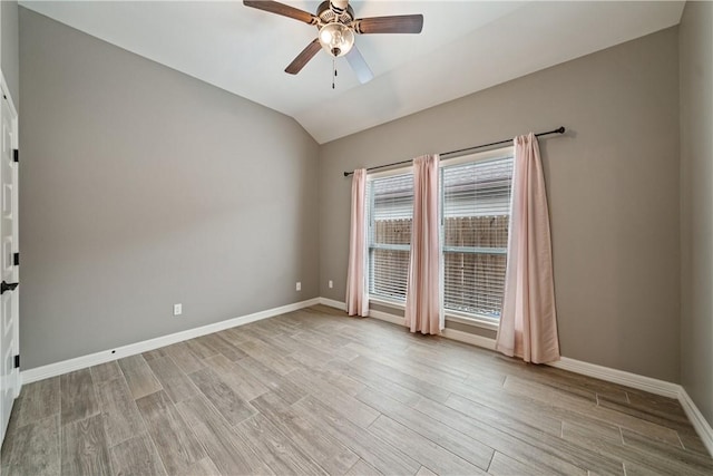 14150 Coquina Bay Ave, Corpus Christi, TX 78418 - empty room featuring ceiling fan, lofted ceiling, baseboards, and light wood-type flooring