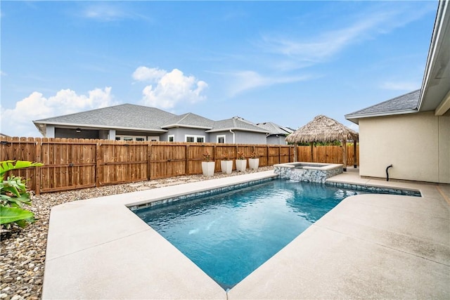14150 Coquina Bay Ave, Corpus Christi, TX 78418 - view of swimming pool featuring a patio area, a pool with connected hot tub, and a fenced backyard