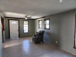 foyer with ceiling fan